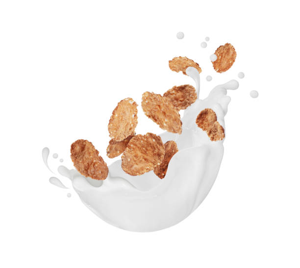 istock Sweet crispy cereal in milk splashes close-up isolated on white background 2189062113