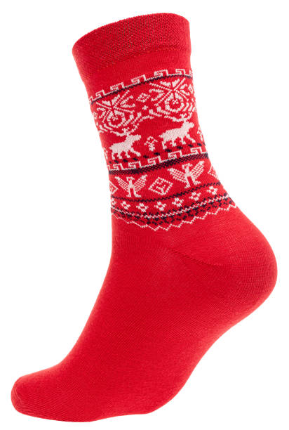 istock Red winter sock with festive Nordic pattern on mannequin isolated 2189062369