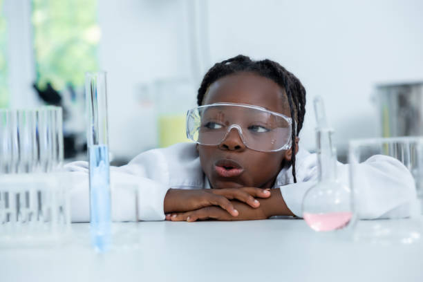 istock Female chemist in lab testing liquid in flask and tube conducting scientific experiments 2189063274