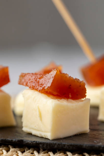 istock Cheese and quince paste snack on a dark slate board 2189065834
