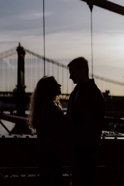 Romantic Silhouette Featuring a Beautiful Bridge as a Background Scene