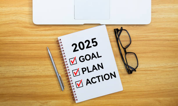 istock 2025 goal, plan, action checklist text on note pad with eyeglasses pen and laptop 2189067684