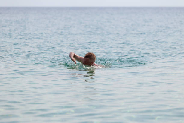 Man tourist enjoy swimming in calm sea water