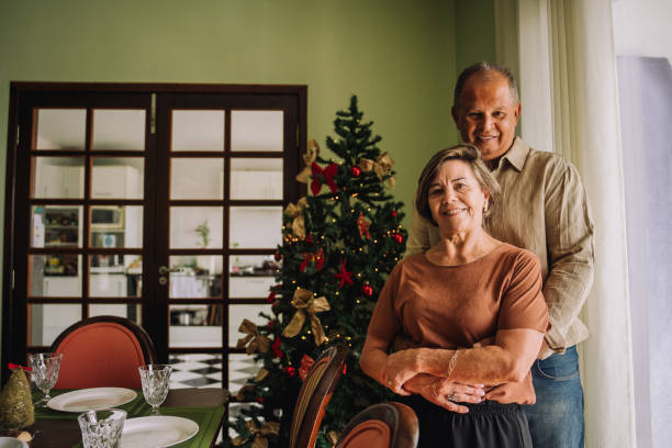 istock Senior couple hugging in the dining room 2189067842
