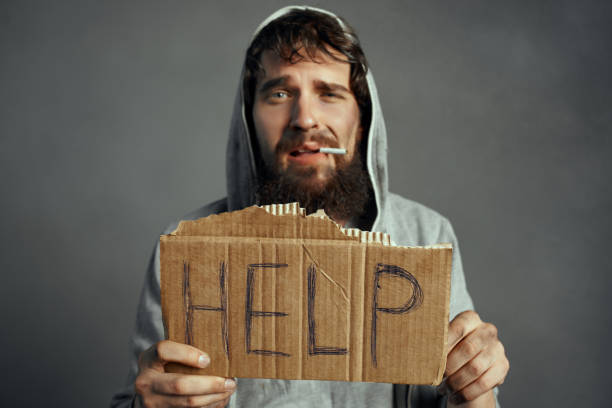 istock poor man with a beard sign help the tramp lifestyle 2189068307