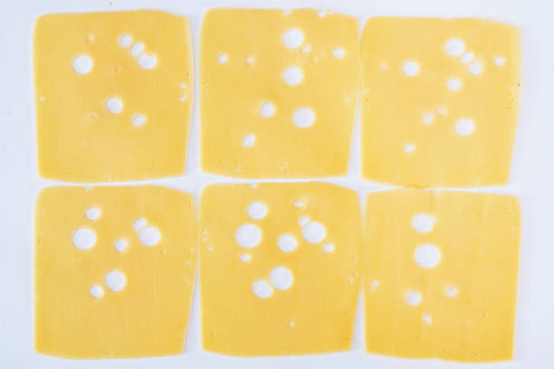 Edam cheese coated with red paraffin wax, isolated on white background