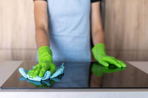 istock Cleaning a modern induction stove in a stylish kitchen 2189069387