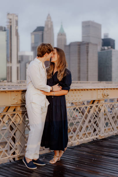 istock A Romantic Couple Deeply Embracing Each Other on the Beautiful Brooklyn Bridge at Dusk 2189069465