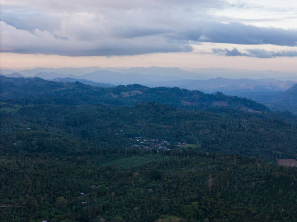 istock Vast green landscape stretches under cloudy sky at dusk in rural area 2189070120