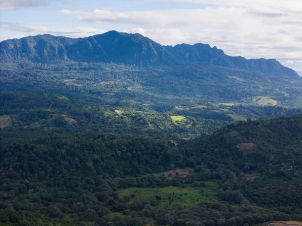 istock Expansive mountain landscape under cloudy sky in lush green valley 2189070148