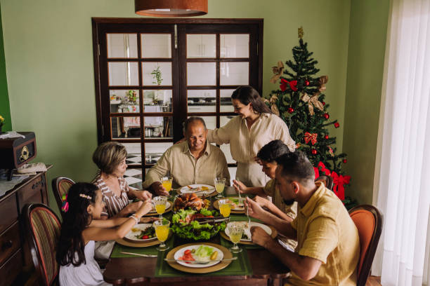 istock Latin family sitting at the table, celebrating Christmas, having dinner 2189071121