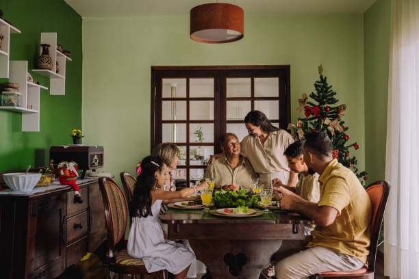 istock Latin family sitting at the table, celebrating Christmas, having dinner 2189071153