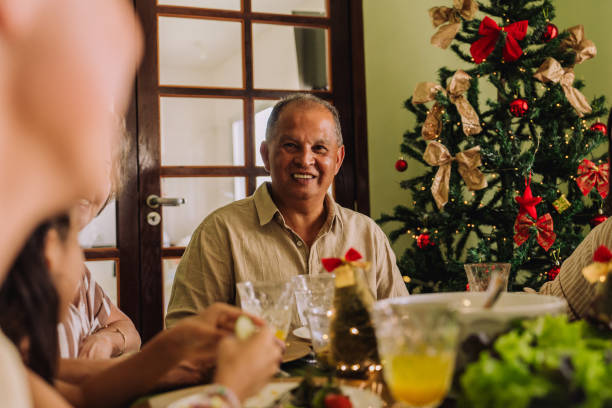 istock Latin family sitting at the table, celebrating Christmas, having dinner 2189071154