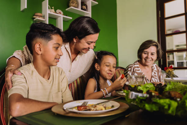 istock Latin family sitting at the table, celebrating Christmas, having dinner 2189071238
