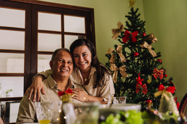 istock Daughter hugging elderly father, celebrating Christmas, 2189071502