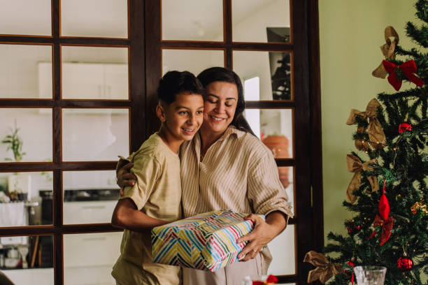 istock Mother giving her son a Christmas present 2189071564