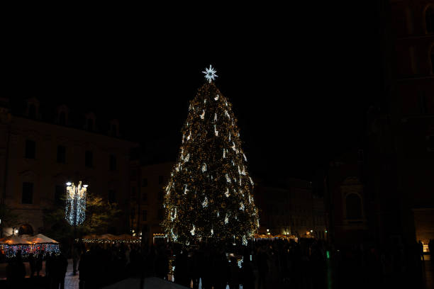 istock Illuminated Christmas Tree at Night in a Festive Square 2189072179