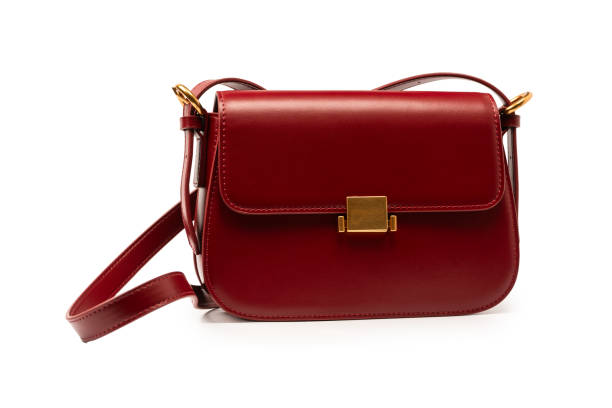 Burgundy shoulder leather bag isolated on a white background.