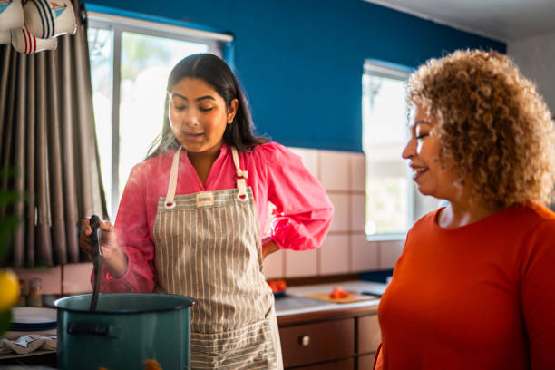 istock Mother and daughter cooking at home 2189074897