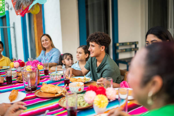 istock Family talking during lunch at house yard 2189075980