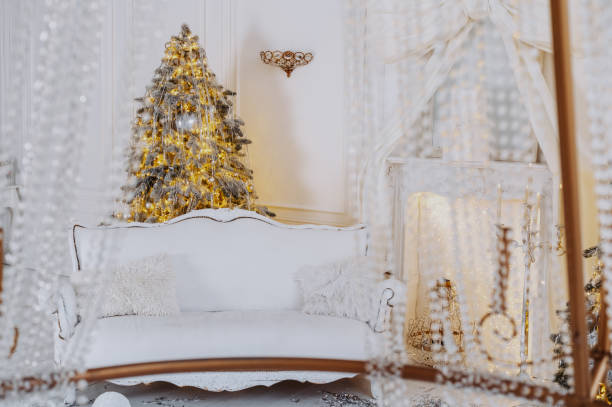 istock Christmas tree and elegant seating create a festive winter atmosphere for 2025 2189076246