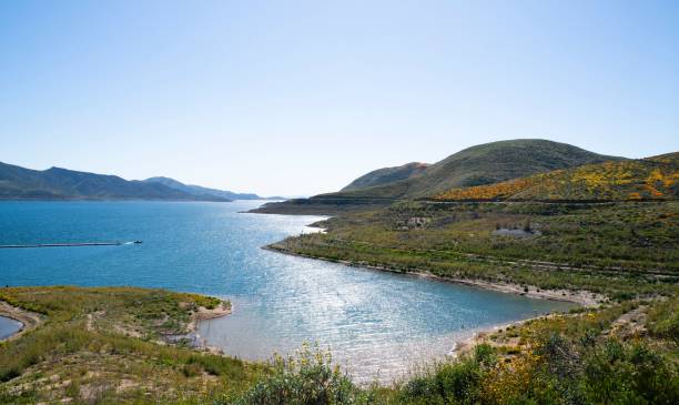 istock Scenic lake and hills under a clear sky. 2189077420