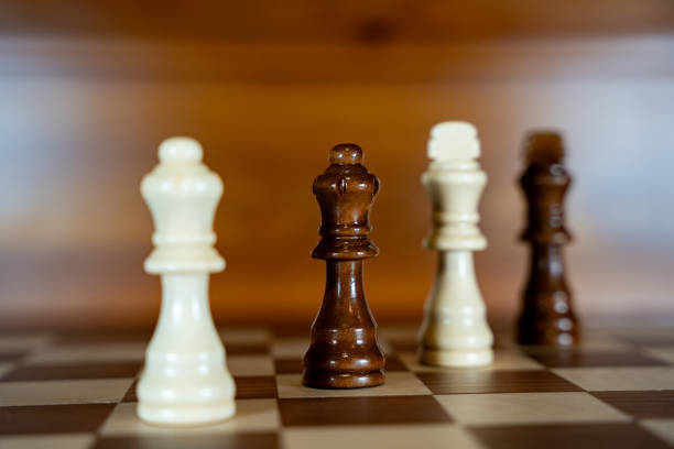 Kings and queens on the board of the chess game.