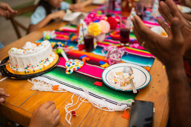 Close-up of table with birthday cake