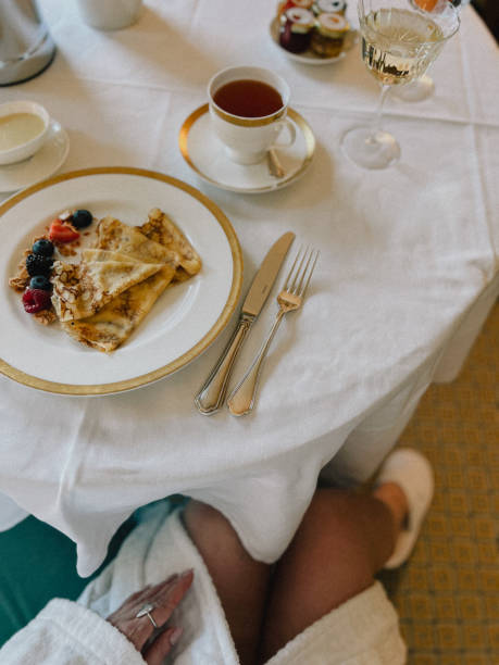 istock Elegant breakfast scene with pancakes, berries, and fine tableware 2189079660