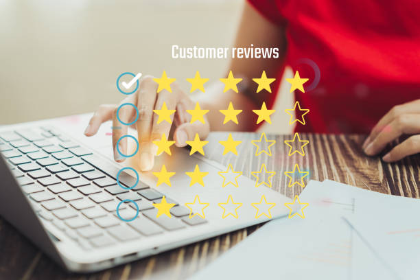 istock Customer reviews displayed on laptop, showcasing ratings and feedback. image captures hand interacting with keyboard, emphasizing user engagement and digital interaction 2189081109