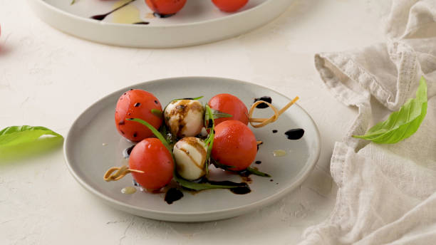 istock Caprese salad with tomato and mozzarella 2189081147