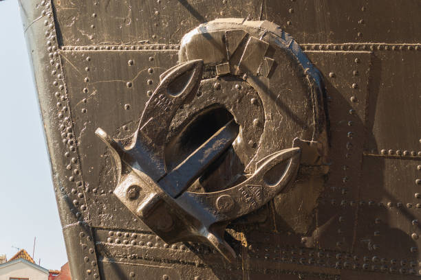 White retracted anchor on old ship's bow