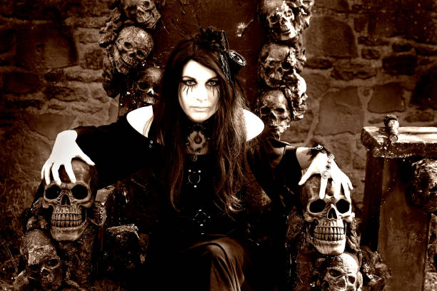 istock Fantasy photo with an evil witch on a throne with skulls 2189082480