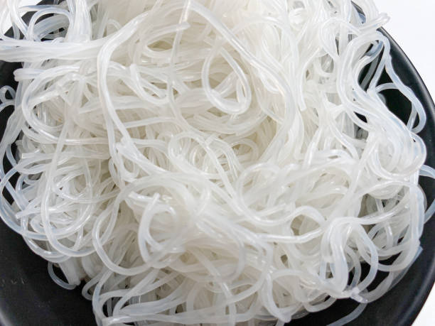 istock Rice noodle on black bowl, isolated on white background 2189084236
