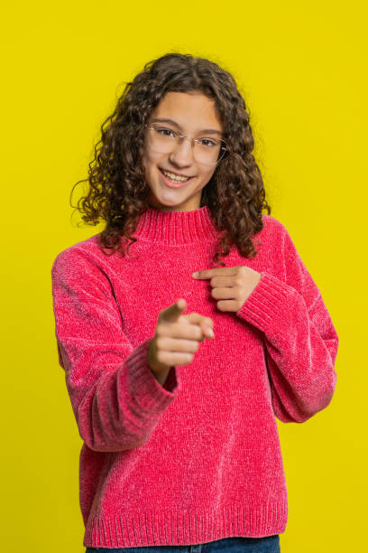 istock Smiling happy girl pointing forward to camera, choosing lucky victory winner, indicating, promotion 2189084305