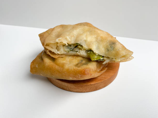 istock Martabak, made from flour dough, egg and leek slices. Snack from Indonesia. Isolated on white background 2189084315