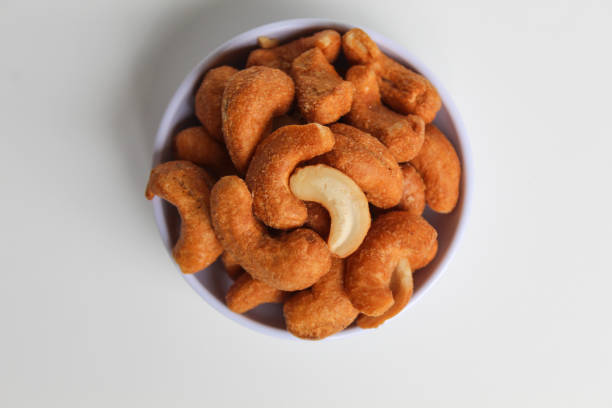 istock Cashew nut in a white small bowl. isolated on white background, flat lay or top view 2189086845