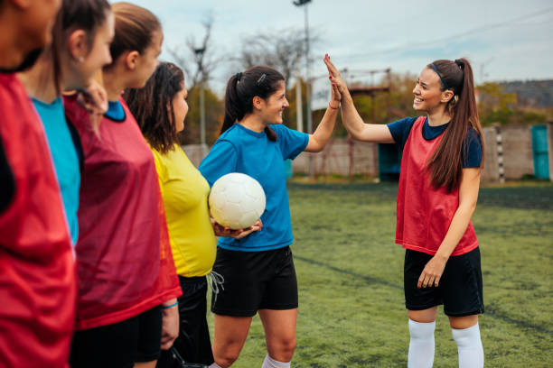 istock Female soccer players high five. 2189087062