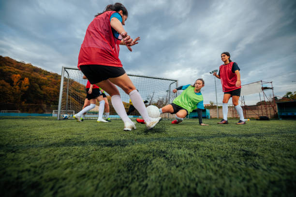 istock Female footballer freekick practice. 2189087124