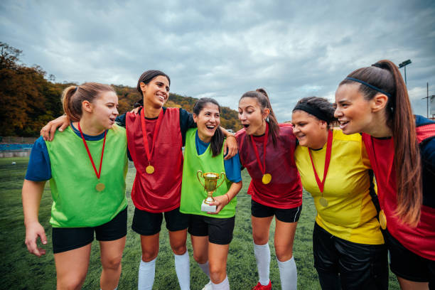 istock Cheerful female football team celebrating win. 2189087135