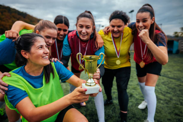 istock Excited female football team celebrating win. 2189087144