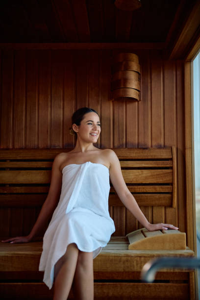 istock Young woman relaxing in sauna while spending her weekend at wellness center. 2189087316