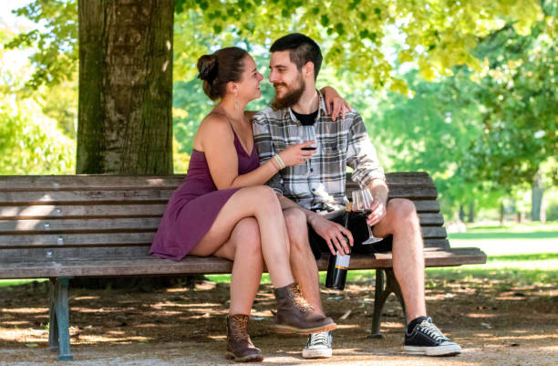 istock Happy couple hug on bench in park 2189087348