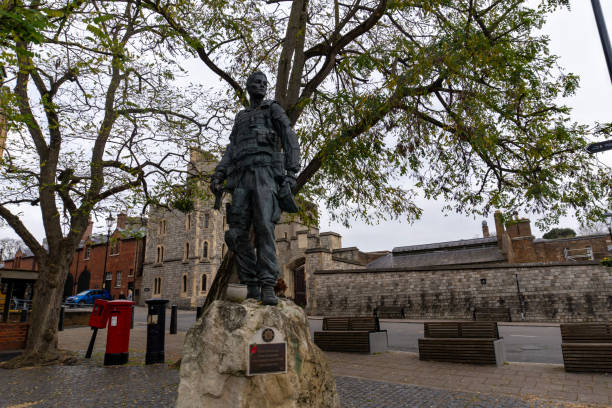 Windsor Castle, Berkshire, United Kingdom, September 20, 2024. Royal residence, palace. View towards Henry VIII gate to the Lower Ward,  just off Castle Hill street. Incidental people. Overcast autumn day outdoors