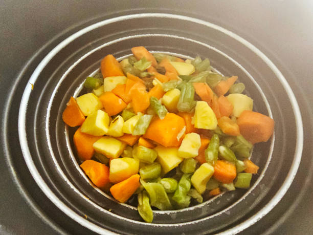 istock Cooking vegetables cut into small pieces in a steamer 2189088638