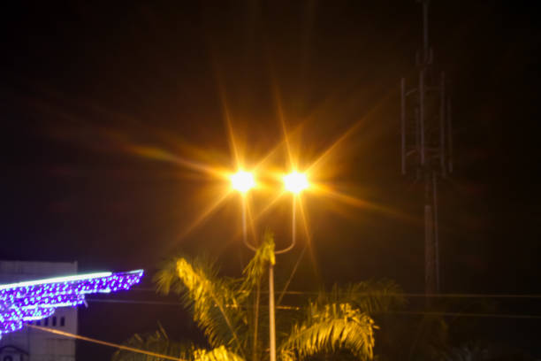 City lights glow at night, illuminating the darkness