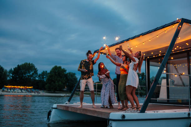 istock Multiracial guys and girls having fun on the catamaran 2189089634