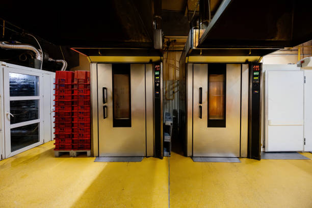 istock Modern bakery. Industrial ovens for baking bread, loafs, cakes and cookies 2189092219