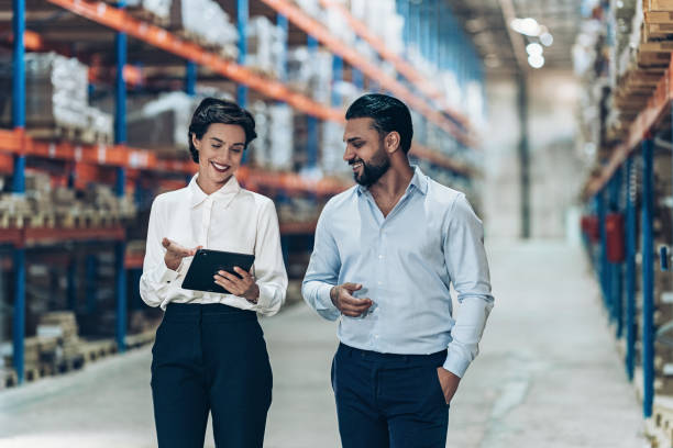 istock Two business person talking in warehouse 2189092250