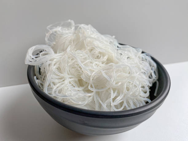 istock Rice noodle on black bowl, isolated on white background 2189092503